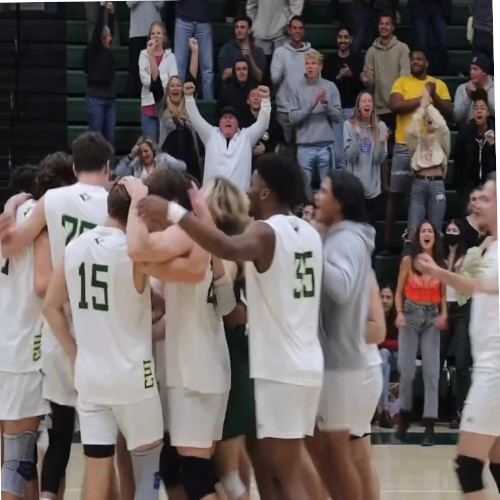 Men’s Volleyball  team celebrating and huddling up after their win against Stanford!